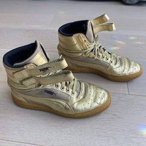 Puma gold high tops with Velcro straps. Gently worn. Size W6.5